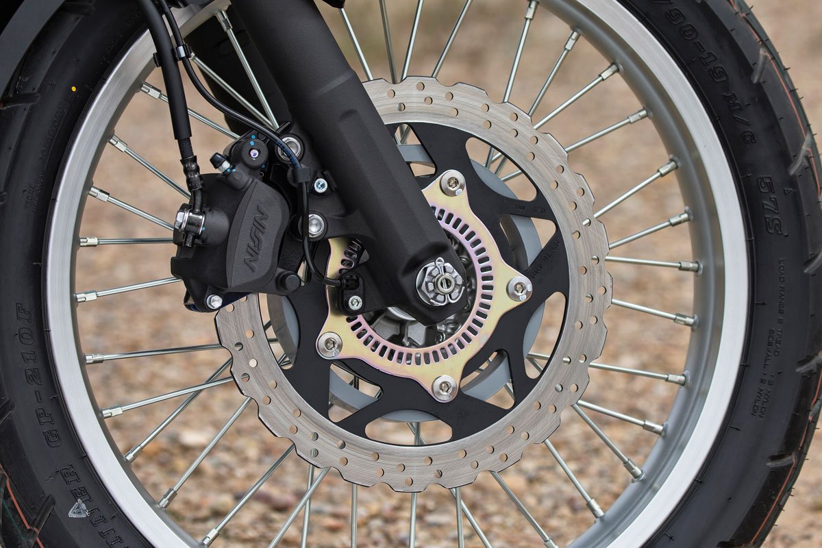 Two-pot Nissin brakes work great.  The beefed up lower slider and oversized hollow axle help stiffen the front end. 